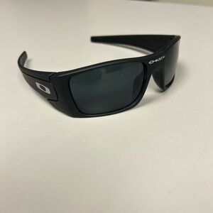 2 pair of Oakley sunglasses .. black pair and yellow pair- not authentic
